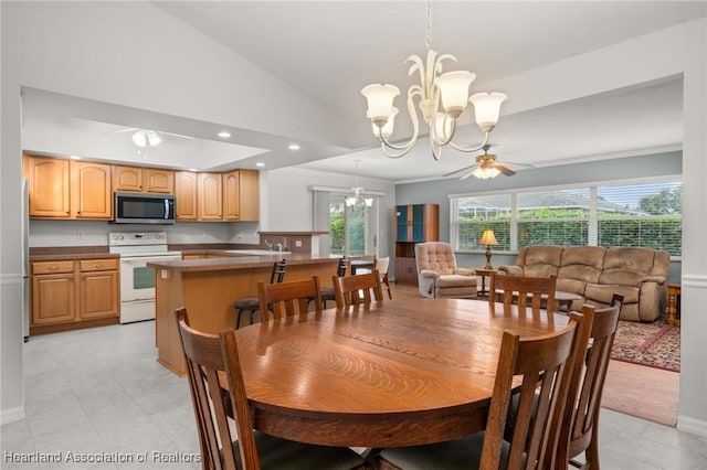 dining room featuring recessed lighting, high vaulted ceiling, and ceiling fan with notable chandelier