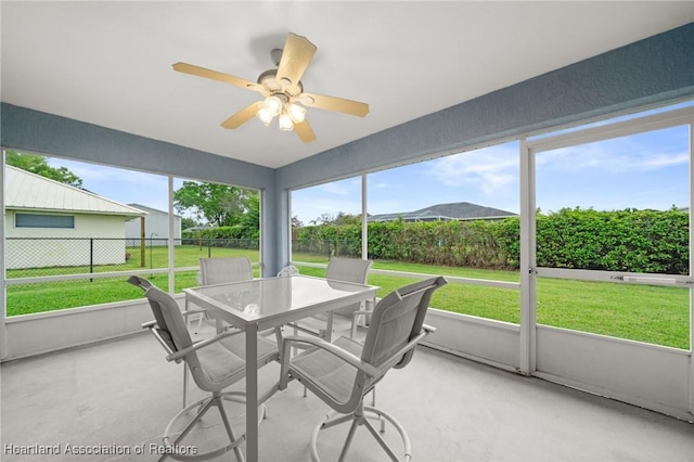 sunroom featuring plenty of natural light and ceiling fan