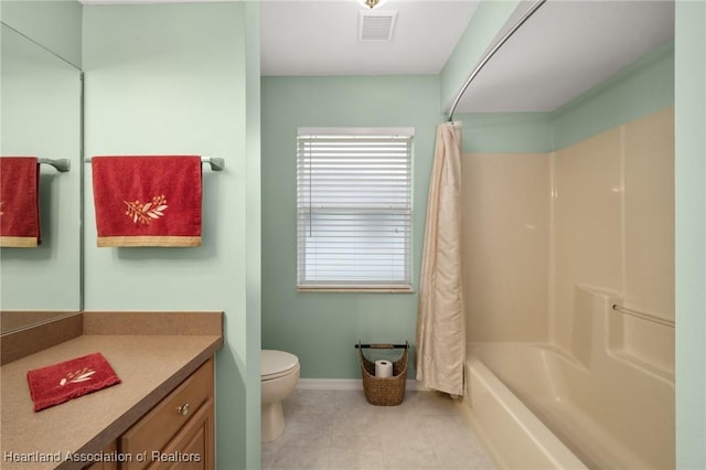 bathroom with vanity, toilet, a healthy amount of sunlight, and visible vents