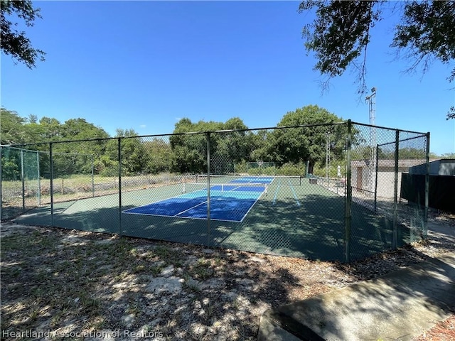 view of sport court with tennis court