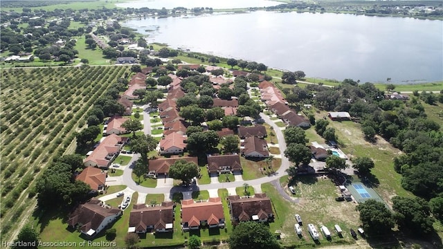 birds eye view of property featuring a rural view and a water view