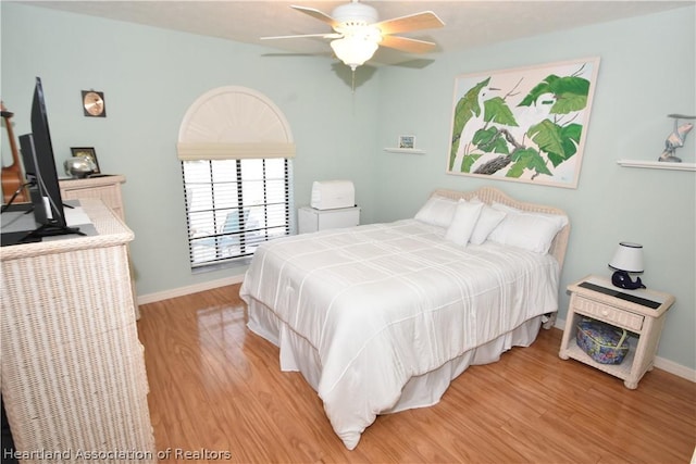 bedroom with light wood-type flooring and ceiling fan