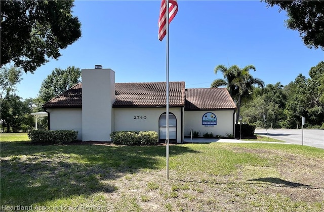 view of home's exterior with a lawn