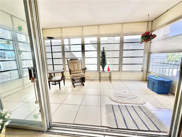 unfurnished sunroom with a wealth of natural light