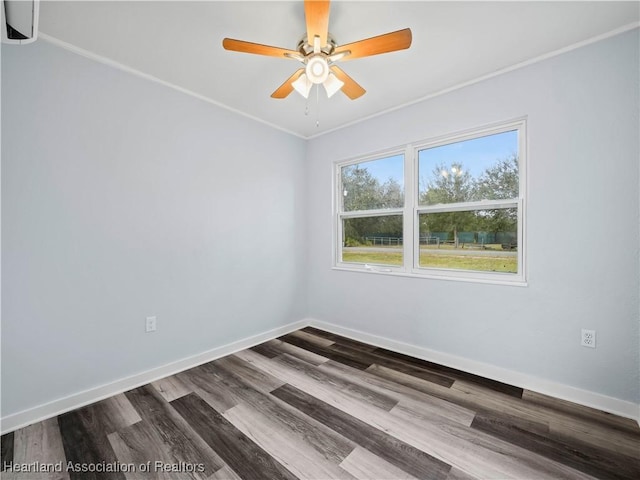 spare room with hardwood / wood-style flooring, ornamental molding, and ceiling fan