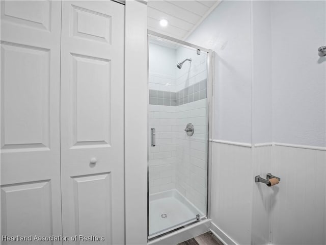 bathroom with a shower with shower door