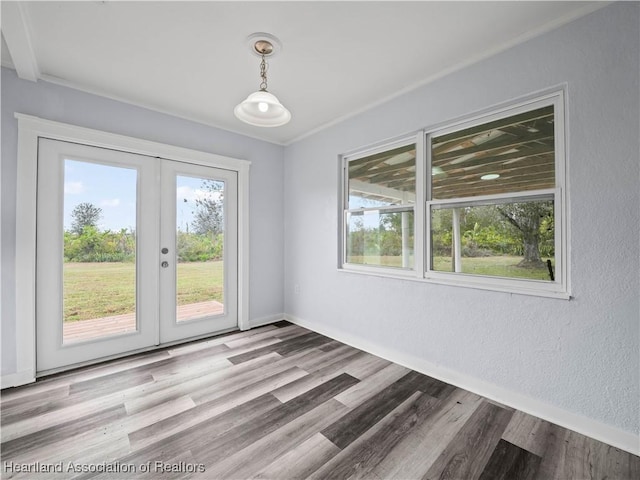 interior space with light wood-type flooring and french doors