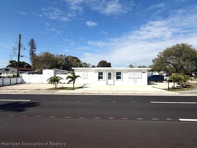9590 NW 22nd Ave, Miami, FL 33147 - view of front facade with fence
