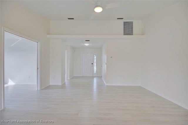 spare room featuring light hardwood / wood-style flooring