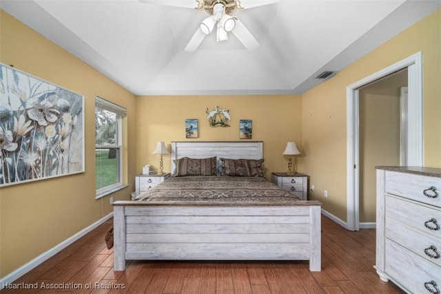 bedroom featuring ceiling fan and dark wood-type flooring