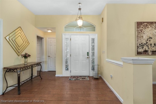 entryway with dark wood-type flooring