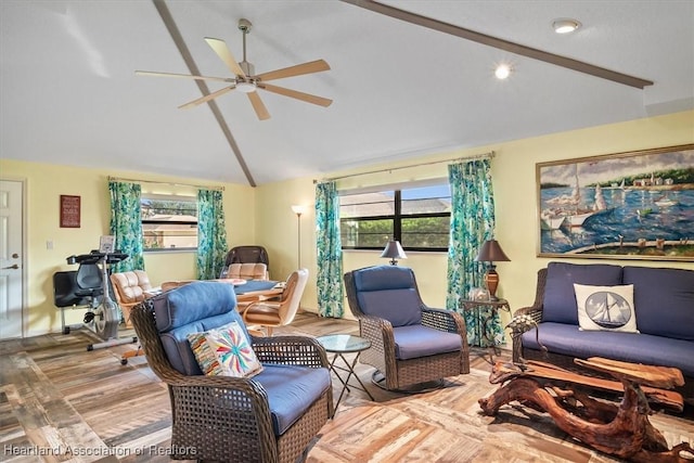 living room featuring ceiling fan, hardwood / wood-style floors, a healthy amount of sunlight, and vaulted ceiling