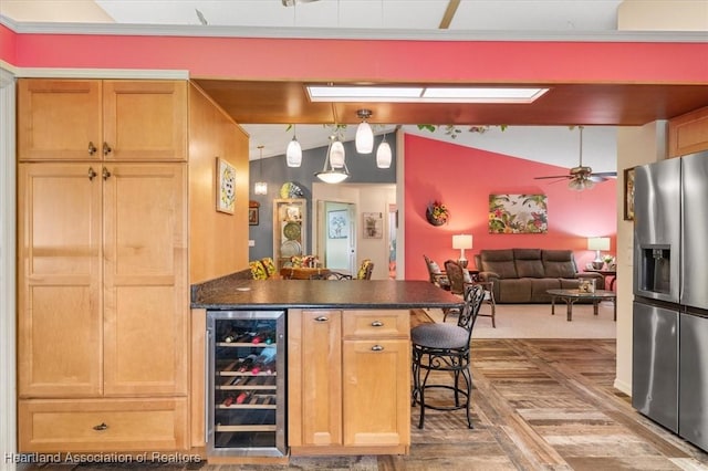 bar featuring hanging light fixtures, ornamental molding, stainless steel refrigerator with ice dispenser, and wine cooler