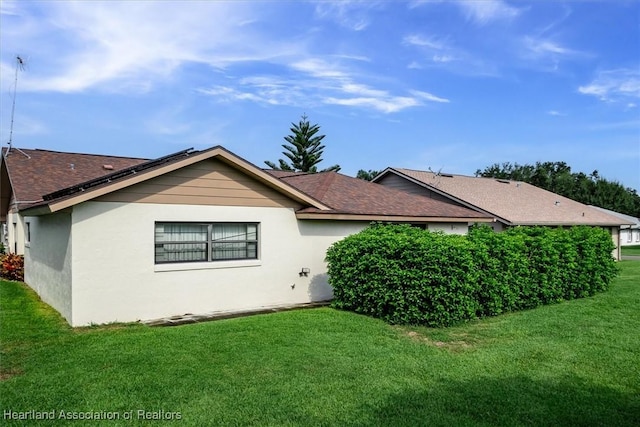 view of property exterior featuring a yard