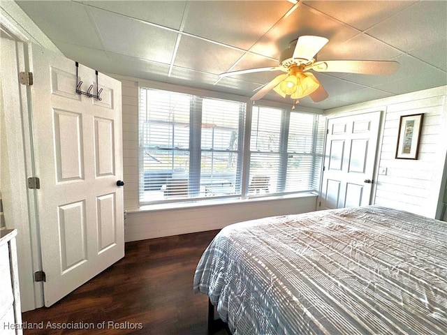 bedroom with a paneled ceiling and ceiling fan