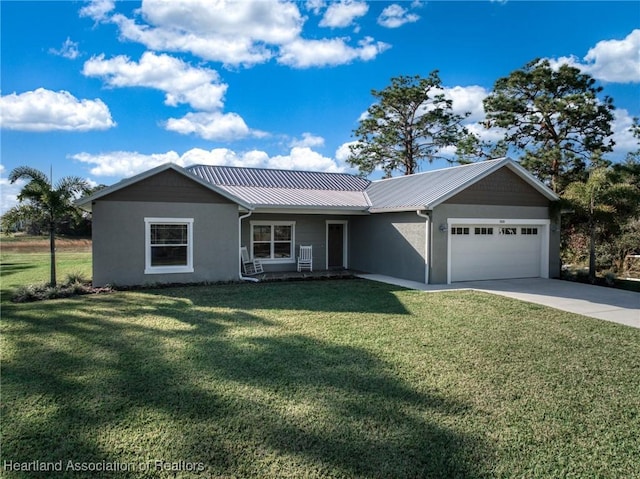 ranch-style house featuring a front lawn and a garage