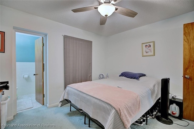 22 W Raymond St, Avon Park, FL 33825 - carpeted bedroom featuring a ceiling fan and connected bathroom