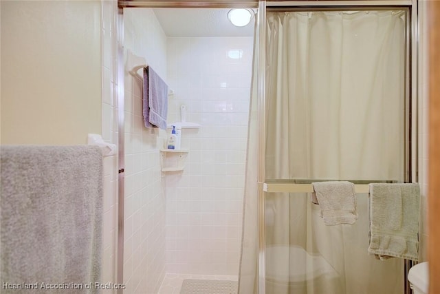 bathroom with a shower with curtain