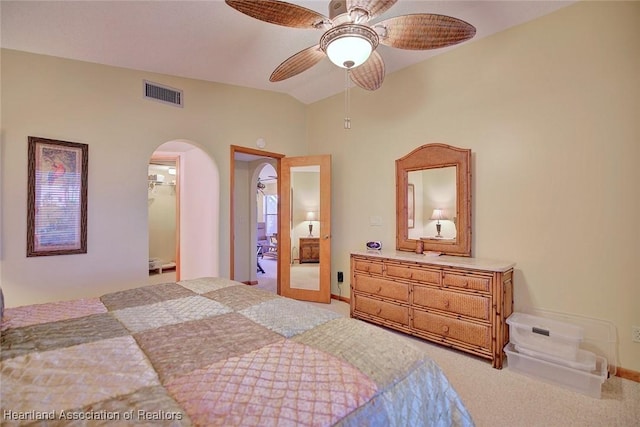 carpeted bedroom featuring ceiling fan and lofted ceiling