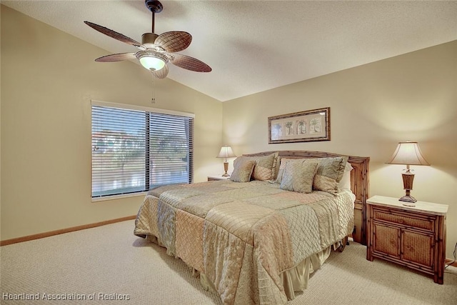 bedroom featuring ceiling fan, light carpet, and vaulted ceiling