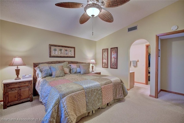 carpeted bedroom featuring ceiling fan and lofted ceiling