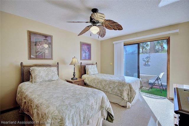 bedroom with access to exterior, carpet, a textured ceiling, and ceiling fan