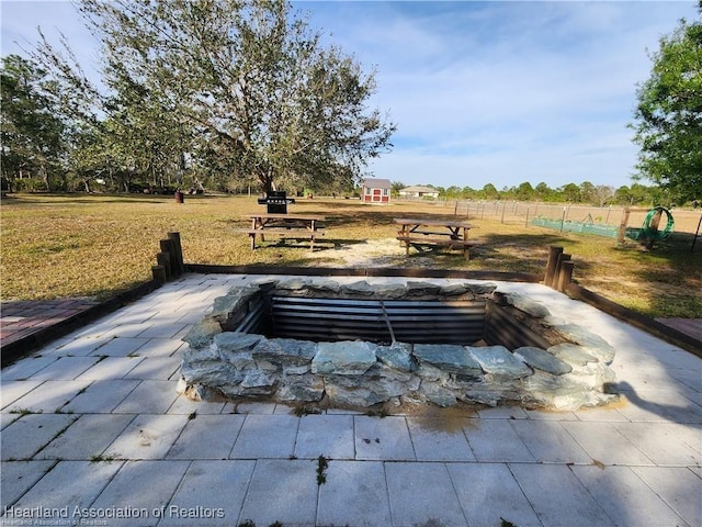 view of community with fence