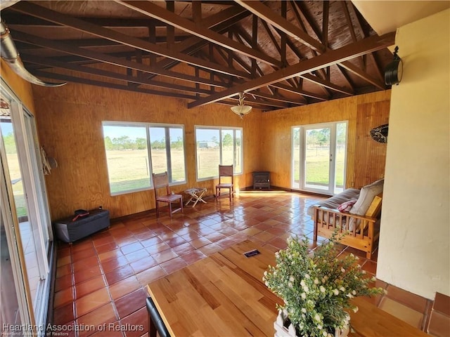 sunroom with lofted ceiling with beams