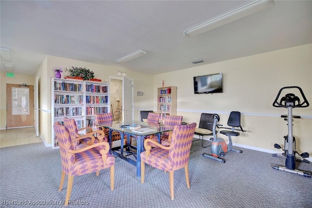 carpeted dining space with visible vents and baseboards