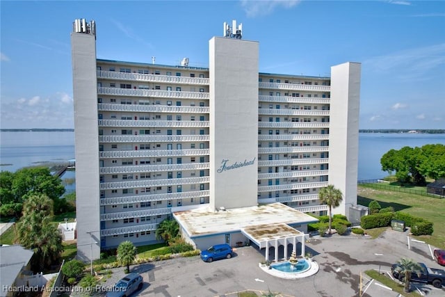 view of building exterior with a water view
