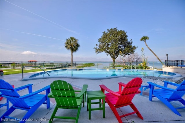 pool featuring a patio and fence