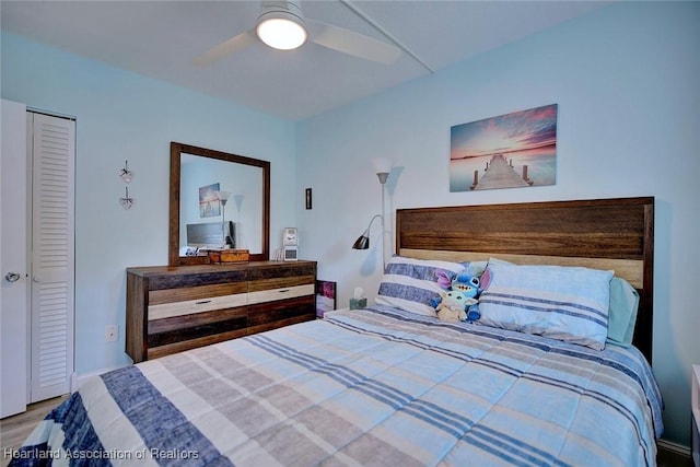 bedroom featuring ceiling fan and wood finished floors