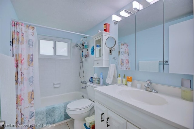 bathroom featuring vanity, shower / bath combo with shower curtain, toilet, and tile patterned floors