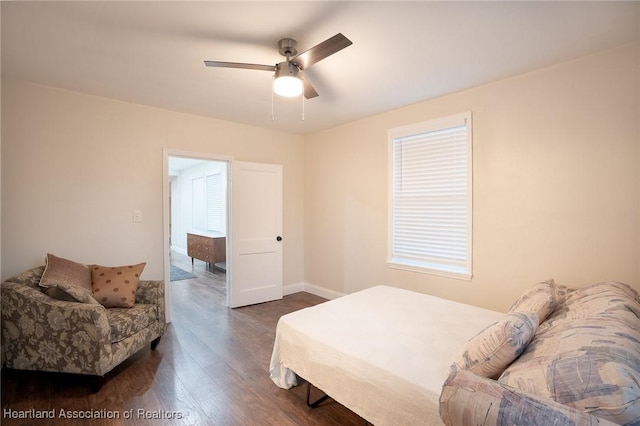 bedroom featuring ceiling fan and dark wood-type flooring