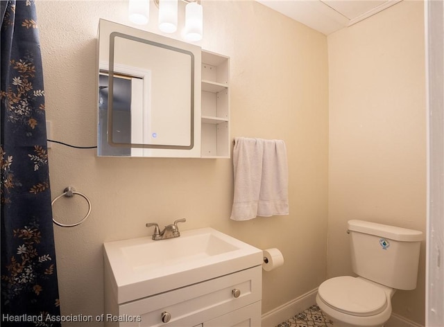 bathroom with vanity and toilet