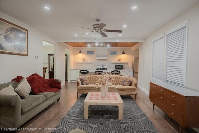 living room featuring ceiling fan, hardwood / wood-style floors, and wooden ceiling