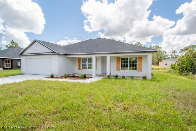 ranch-style home featuring a front yard, a garage, and covered porch