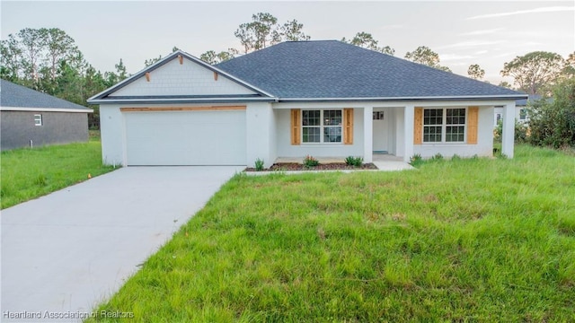 view of front of house featuring a front lawn, a porch, and a garage