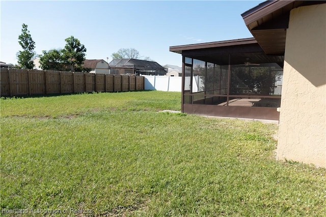 view of yard with a sunroom