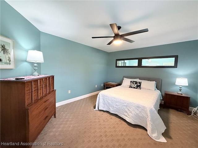 bedroom featuring a ceiling fan, carpet, and baseboards