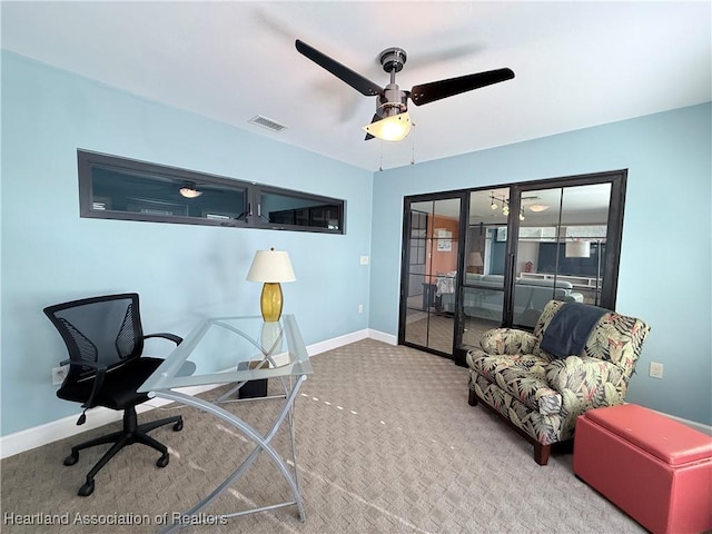 carpeted home office with ceiling fan, french doors, visible vents, and baseboards