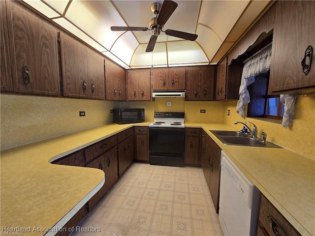 kitchen featuring dark brown cabinetry, sink, electric range, white dishwasher, and ceiling fan