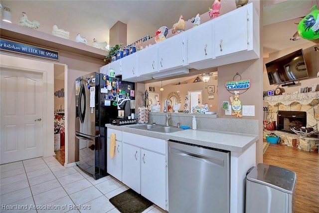 kitchen featuring white cabinetry, sink, and stainless steel dishwasher