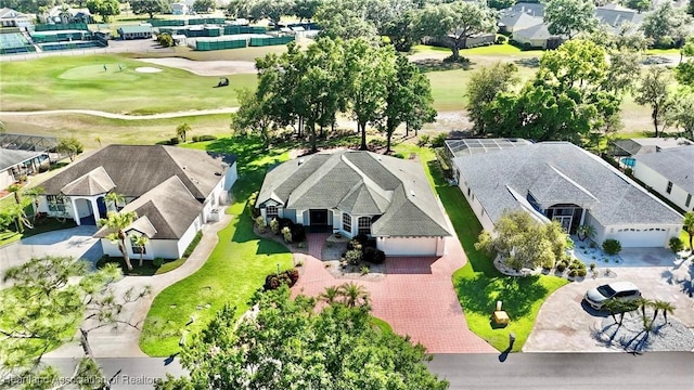 drone / aerial view featuring a residential view and golf course view
