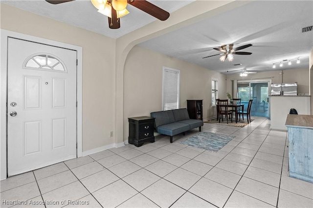 1108 Edgemoor Ave, Sebring, FL 33870 - entryway with ceiling fan and light tile patterned floors