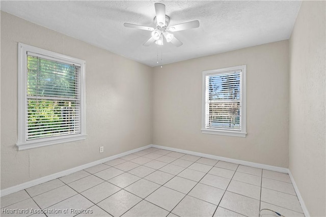 1108 Edgemoor Ave, Sebring, FL 33870 - spare room with light tile patterned floors, a textured ceiling, and a ceiling fan
