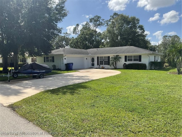 1570 Spring Ln, Lake Placid, FL 33852 - ranch-style home featuring an attached garage, a front yard, stucco siding, and driveway