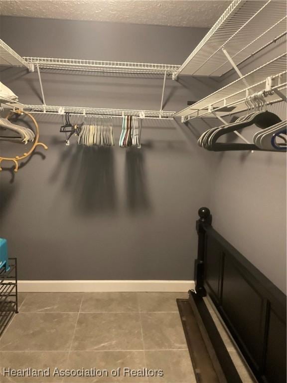 1570 Spring Ln, Lake Placid, FL 33852 - spacious closet featuring tile patterned floors