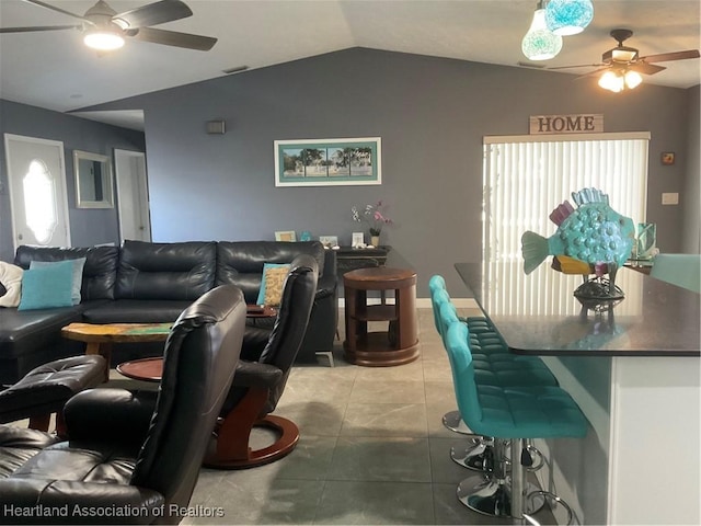 1570 Spring Ln, Lake Placid, FL 33852 - living area with a ceiling fan, vaulted ceiling, light tile patterned floors, and plenty of natural light
