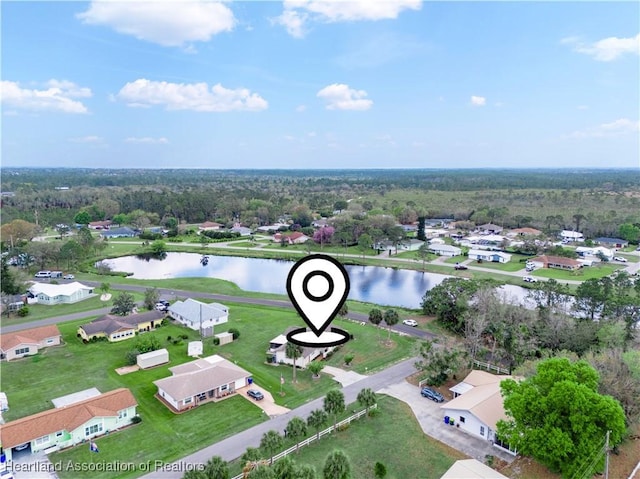 drone / aerial view with a residential view and a water view